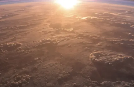 View of Earth’s horizon from space with sunlight breaking through the atmosphere, representing aerospace, defense, and government innovation — Beacon Hill Government Services staffing for aerospace and federal programs