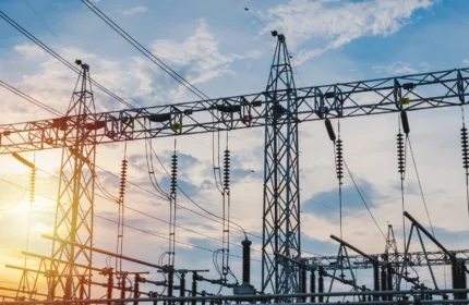 Utility infrastructure showing high-voltage power lines and transmission towers.