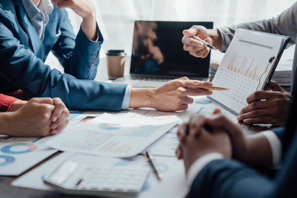 Business leaders reviewing workforce planning reports, labor market data, and staffing strategy analytics during a contingent workforce planning meeting for 2027.